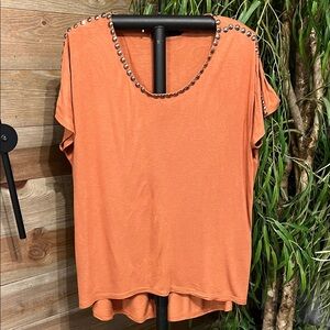 Eloquii rust color short sleeve knit top with studded neck embellishments. 14
